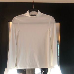 White top with flare cuff sleeves